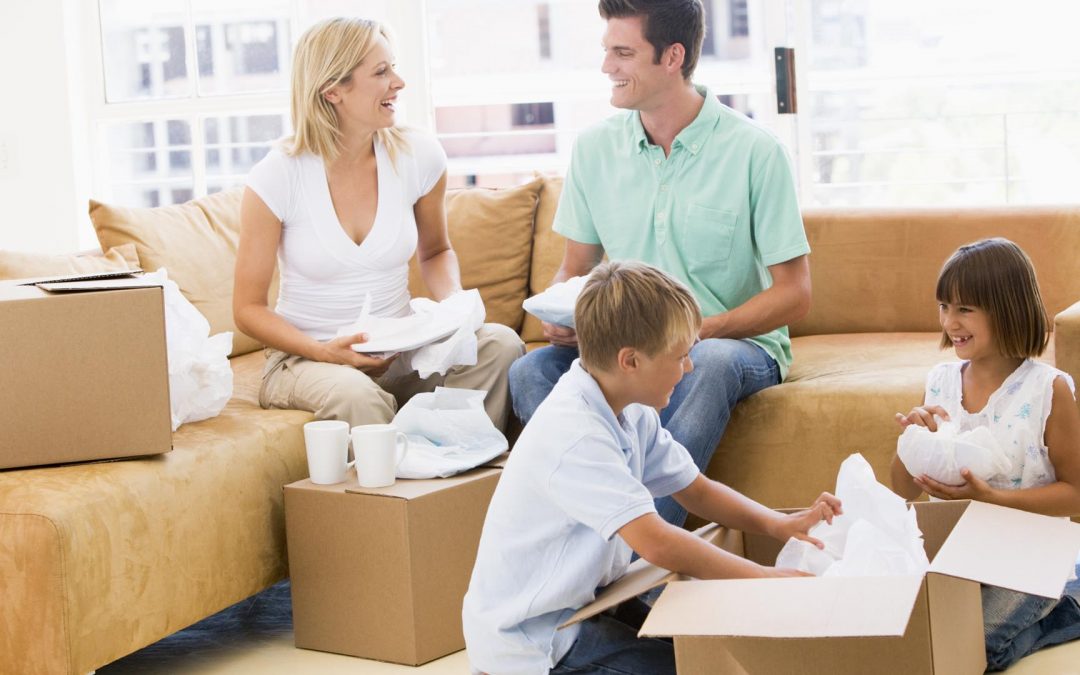 movers helping in packing goods
